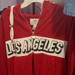 Red mesh (inside) hoodie that says “Los Angeles”
